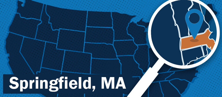 blue map of the U. S. with magnifying glass highlighting massachusetts with a location marker over the Springfield area